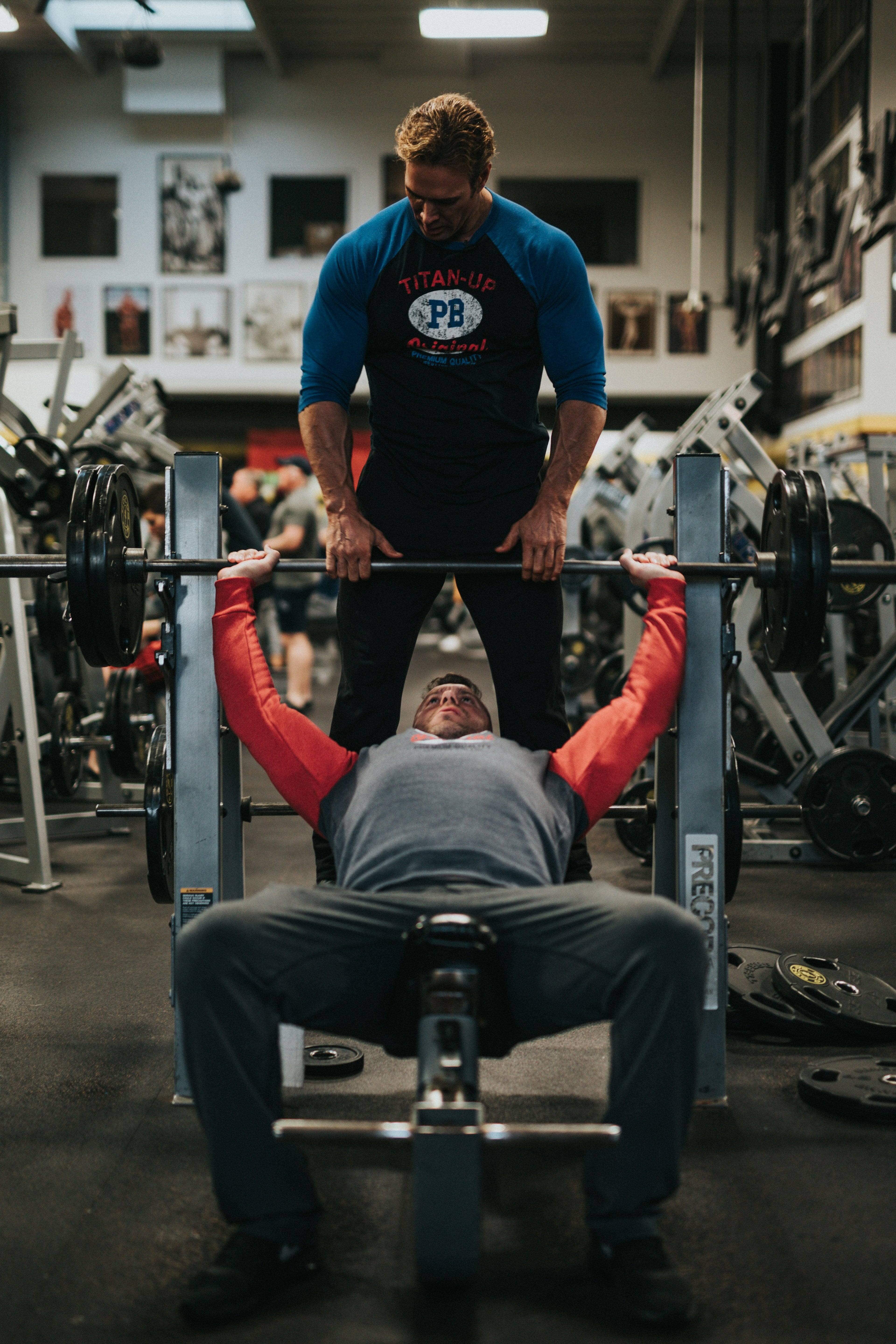 A coach guiding a trainee through an exercise